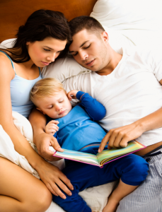 parents reading to baby