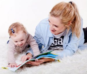 parent and baby reading