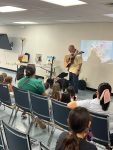 Musician Aaron Fowler came to the library with his a trained therapy dog on Thursday, June 20th to present his “The Adventure Begins Today!” Summer Reading program.