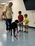 Musician Aaron Fowler came to the library with his a trained therapy dog on Thursday, June 20th to present his “The Adventure Begins Today!” Summer Reading program.