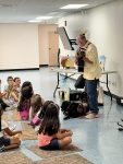 Musician Aaron Fowler came to the library with his a trained therapy dog on Thursday, June 20th to present his “The Adventure Begins Today!” Summer Reading program.