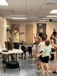 Musician Aaron Fowler came to the library with his a trained therapy dog on Thursday, June 20th to present his “The Adventure Begins Today!” Summer Reading program.