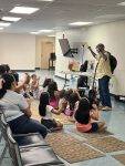 Musician Aaron Fowler came to the library with his a trained therapy dog on Thursday, June 20th to present his “The Adventure Begins Today!” Summer Reading program.