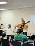 Musician Aaron Fowler came to the library with his a trained therapy dog on Thursday, June 20th to present his “The Adventure Begins Today!” Summer Reading program.